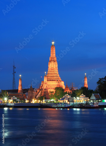 Twilight view of Wat Arun across Chao Phraya River © pimonpim