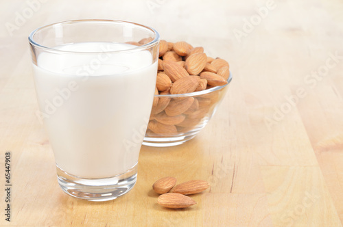 Glass of Almond milk on a table.