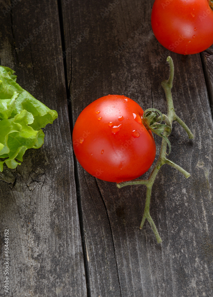 Tomato on old grey wood