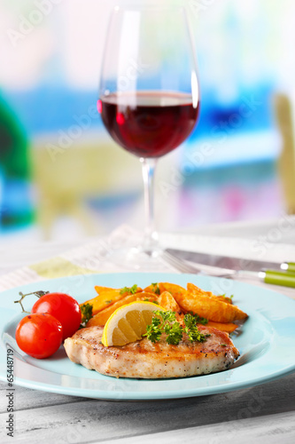 Grilled steak, grilled vegetables and fried potato pieces