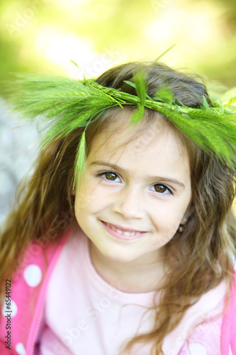 Happy little girl in the gr...