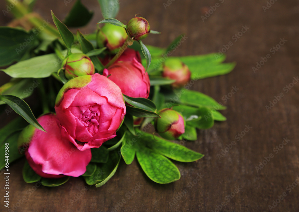 Beautiful peonies on wooden background Beautiful peonies on wooden background