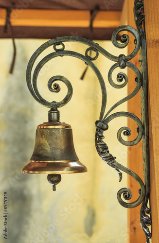 Golden bell and iron grid decoration photo