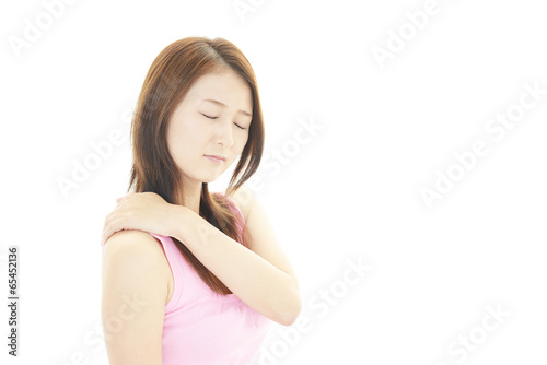 肩痛を訴える女性 © sunabesyou