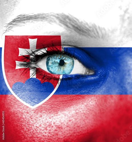 Woman face painted with flag of Slovakia
