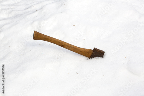 Ax head buried in snow