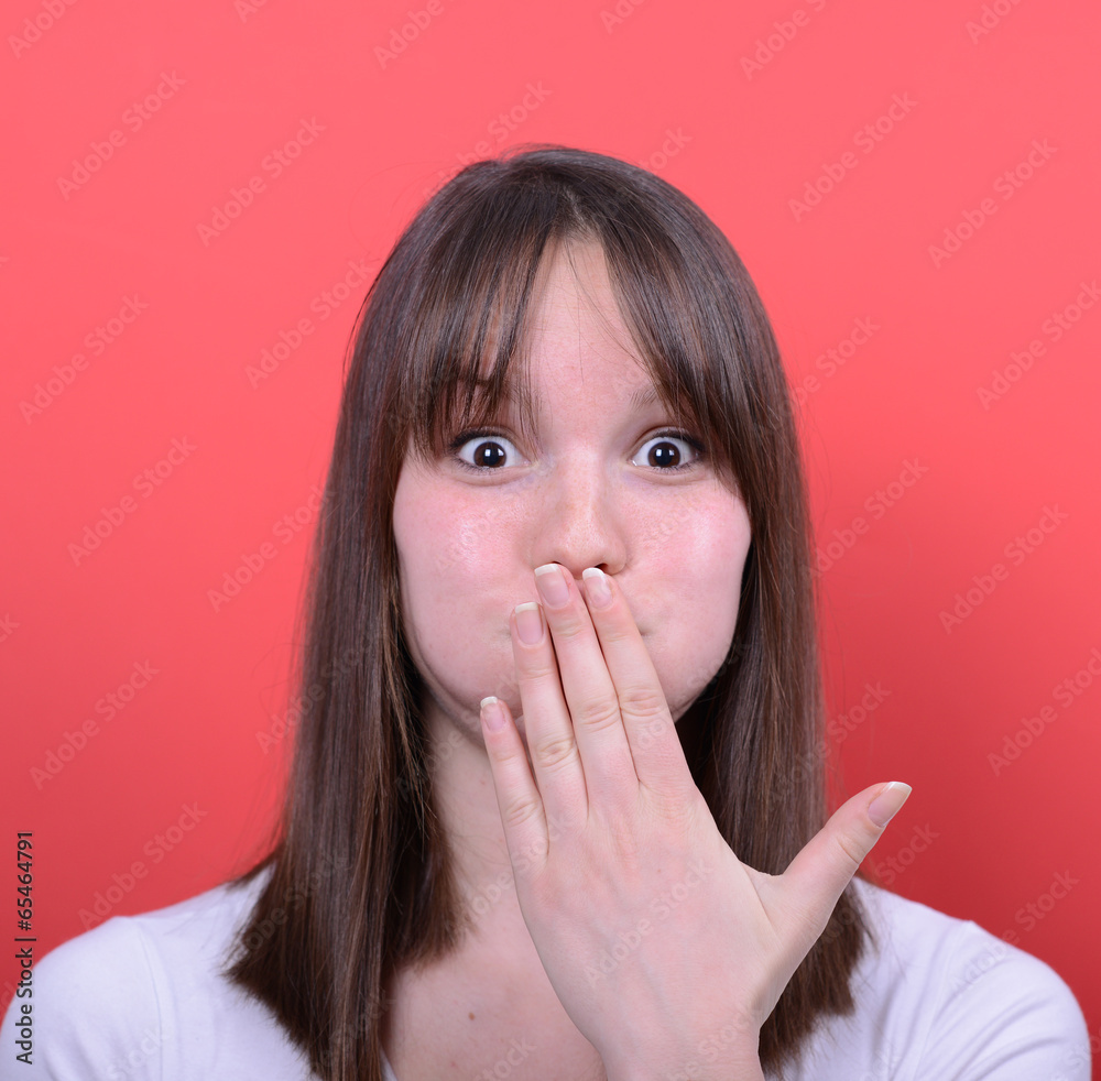 Portrait of amazed girl against red background Portrait of amazed girl against red background