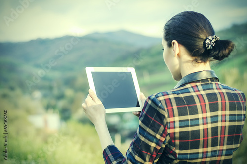 Happy woman with tablet pc