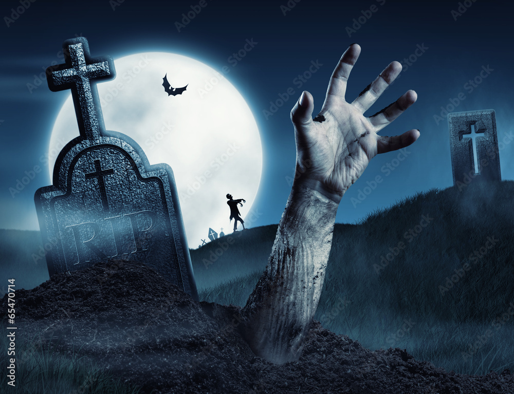 Fototapeta premium Zombie hand coming out of his grave