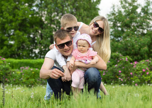 Portrait Of Happy Family In Garden © gawriloff