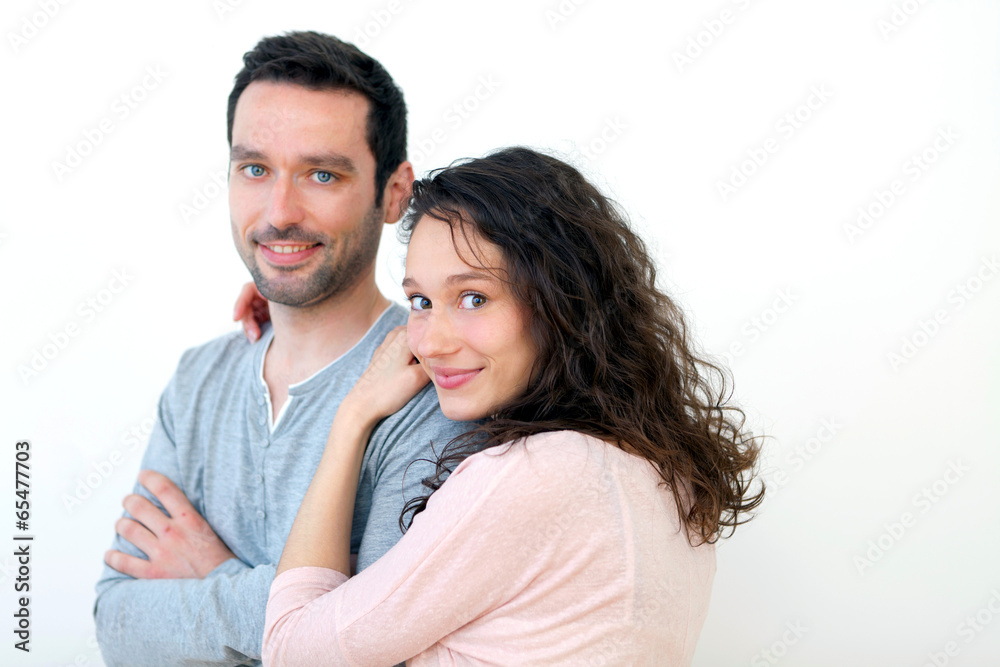 Portrait of a young happy couple on a white background Portrait of a young happy couple on a white background