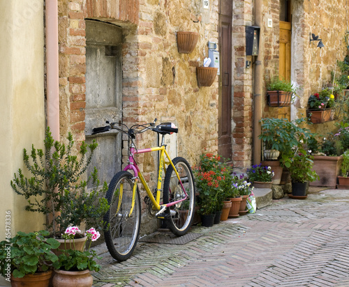 Bicycle stands on the street in the town of Pienza