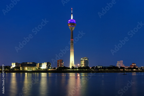 Evening view on the Rheinturm TV tower in Dusseldorf, Germany photo