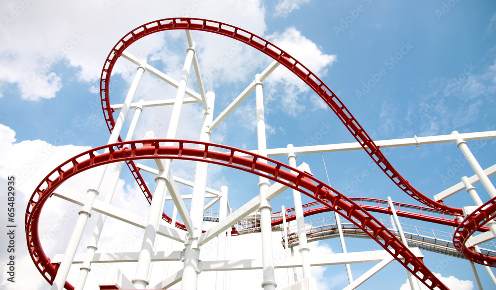 Roller of coaster against blue sky.