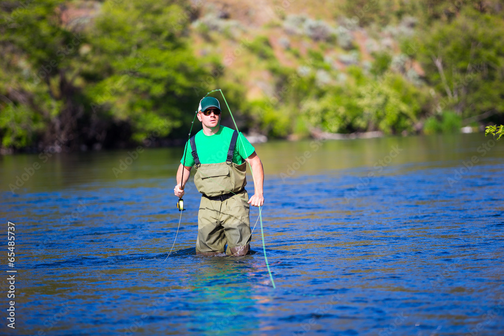Fly Fisherman Casting on the Deschutes River Fly Fisherman Casting on the Deschutes River