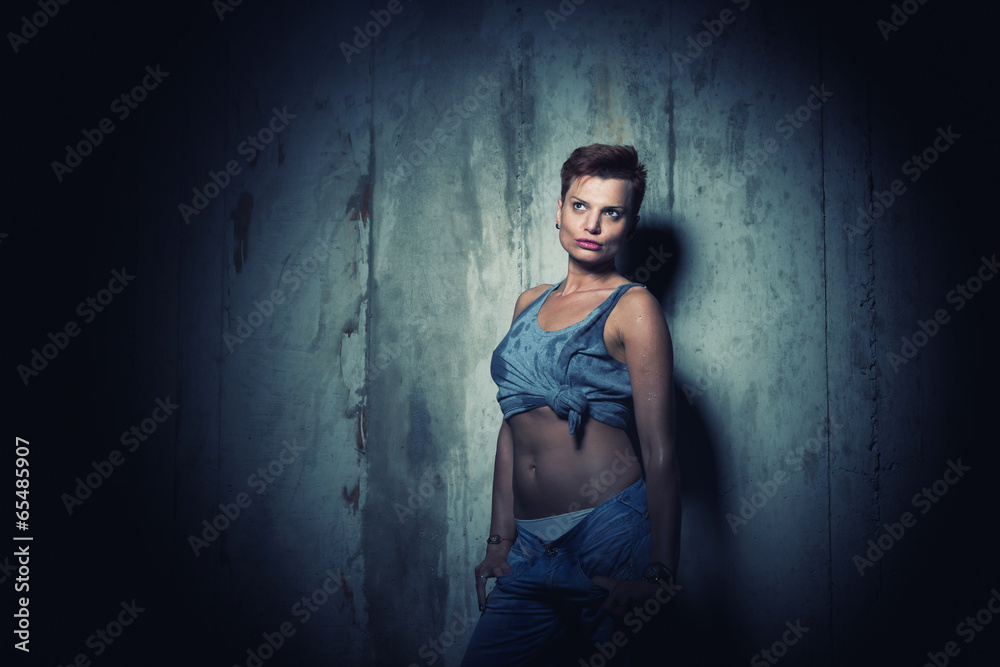 Woman on concrete Wall Background.