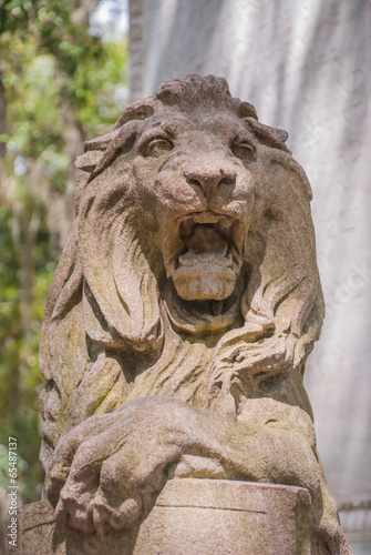 Stone Lion Statue in Urban Park