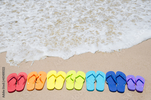 Color flip flops by the ocean