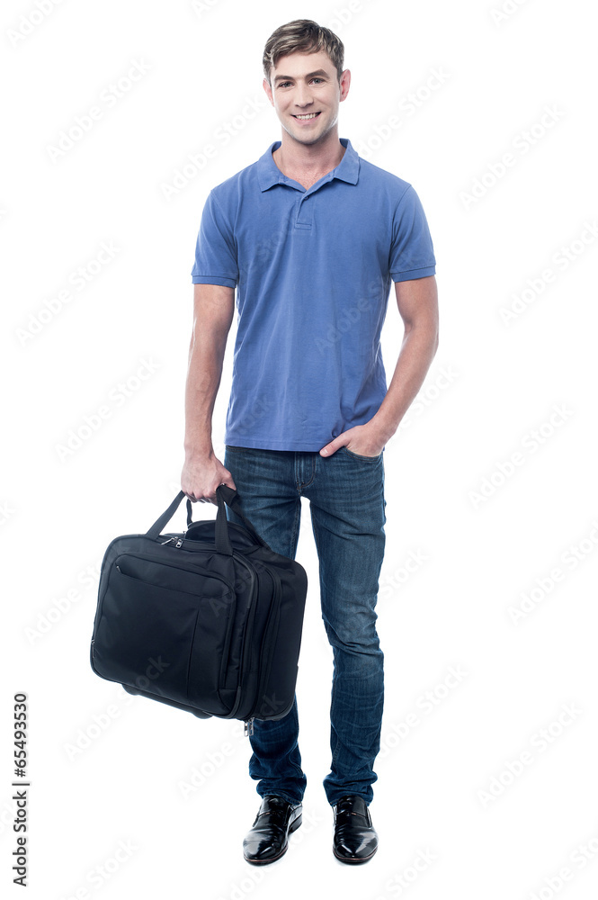 Fototapeta premium Smiling man standing with bag