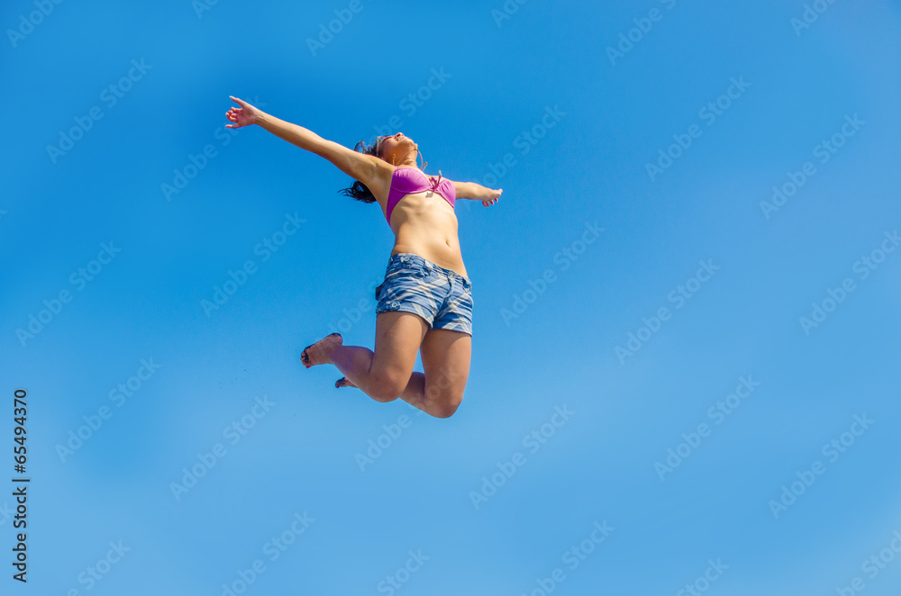 Girl is jumping in the air