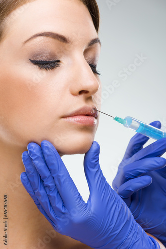 Obraz na płótnie Flawless female face - plastic surgery, lip augmentation