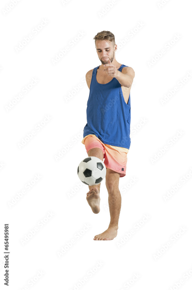 Young attractive guy playing with football isolated on white