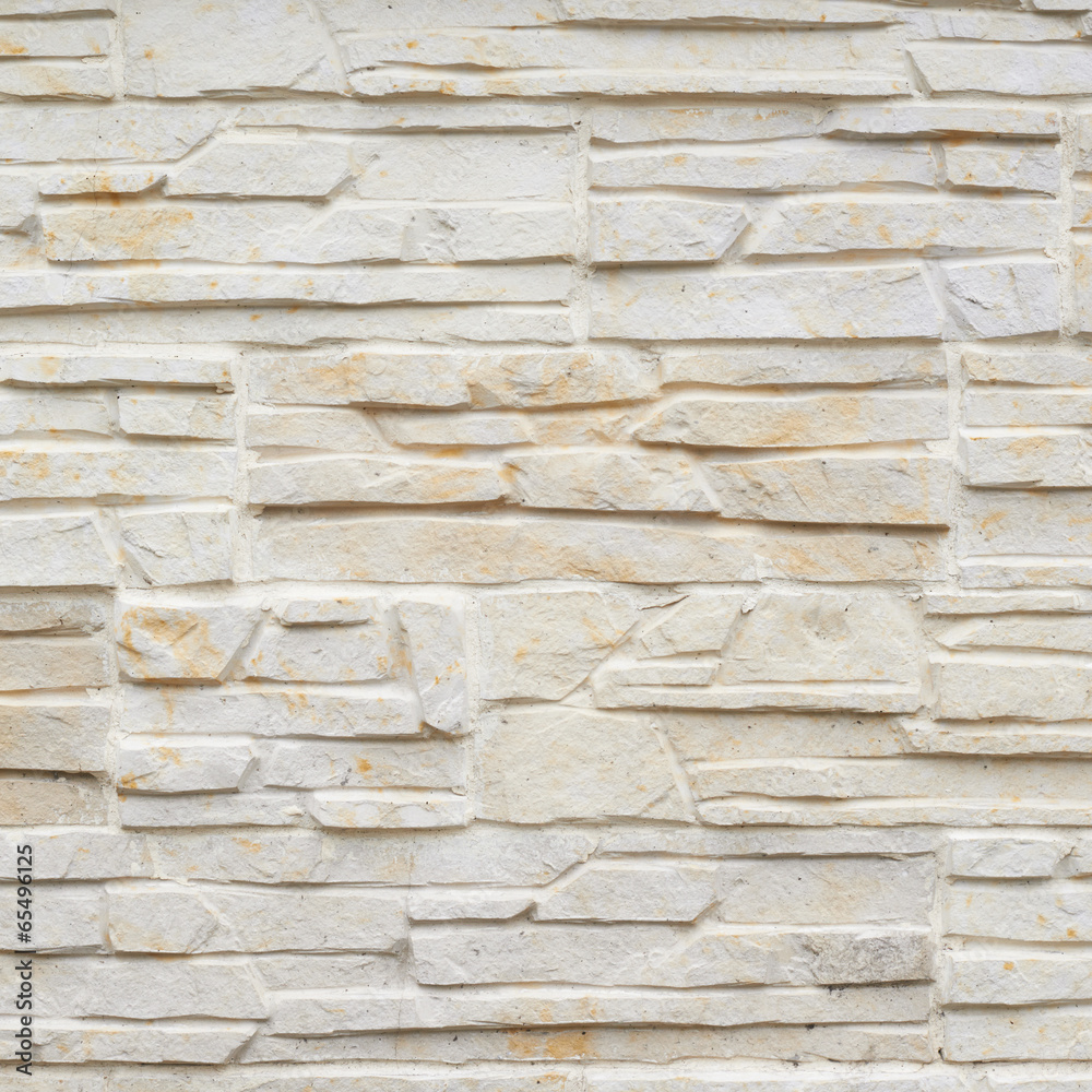 Wall of carved limestone bricks