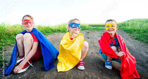 children  acting like a super hero photo