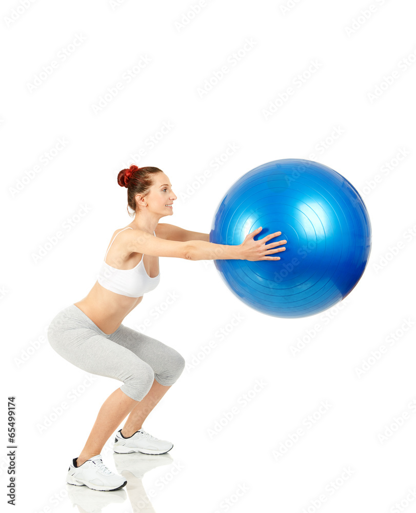 Fitness girl doing squats with pilates ball Fitness girl doing squats with pilates ball