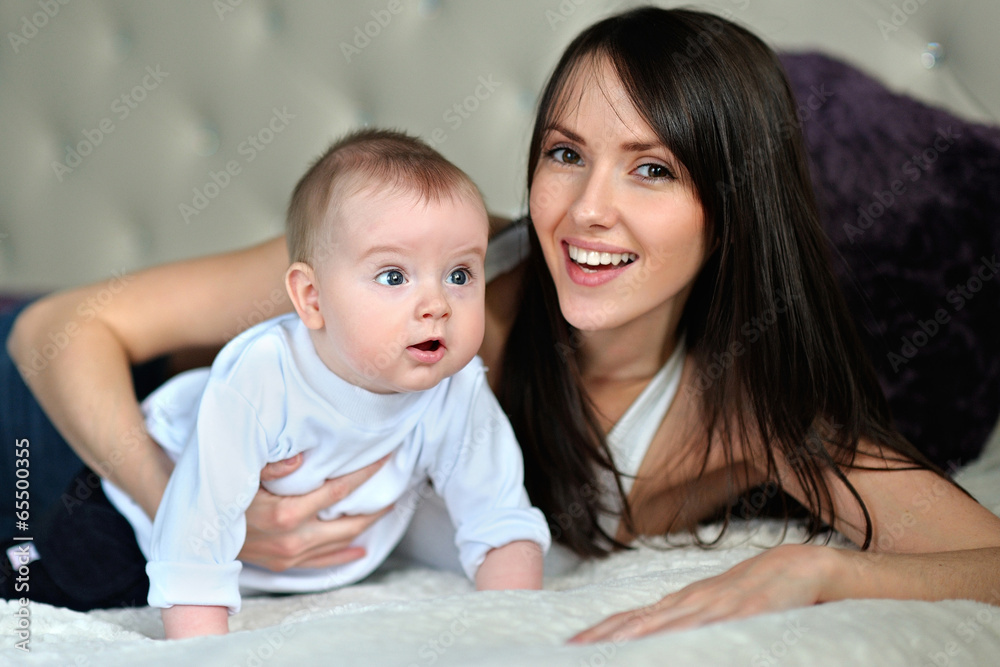Portrait of a happy mother and baby