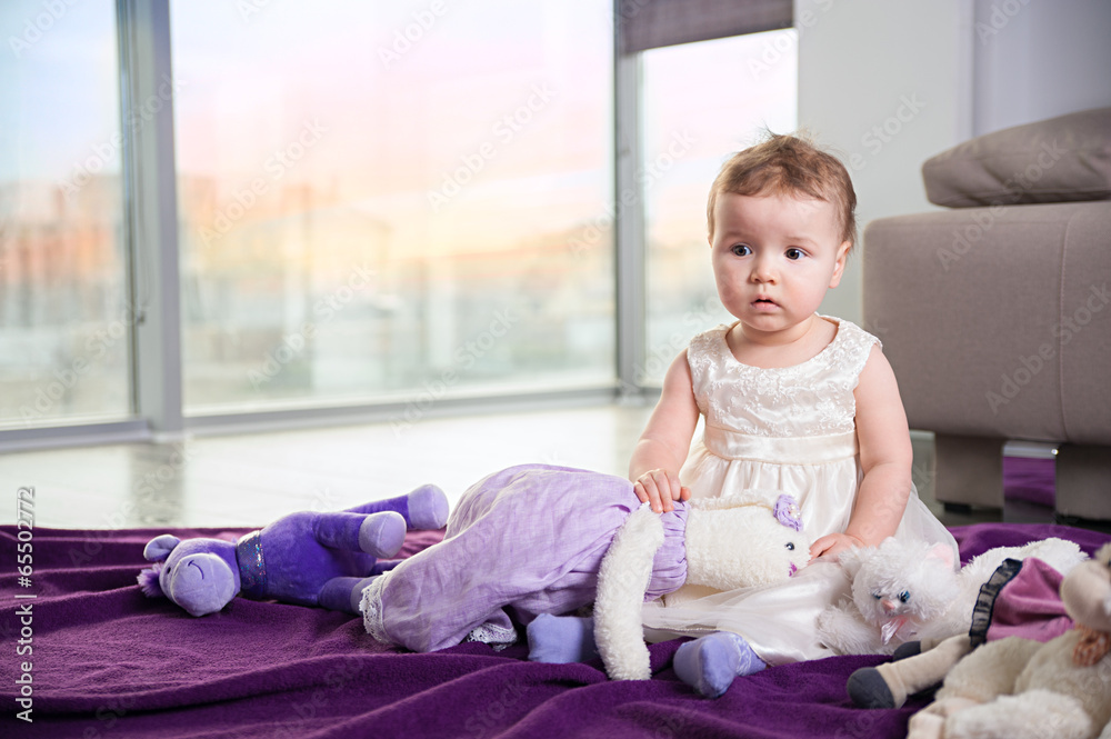 The little girl is playing with her toys The little girl is playing with her toys