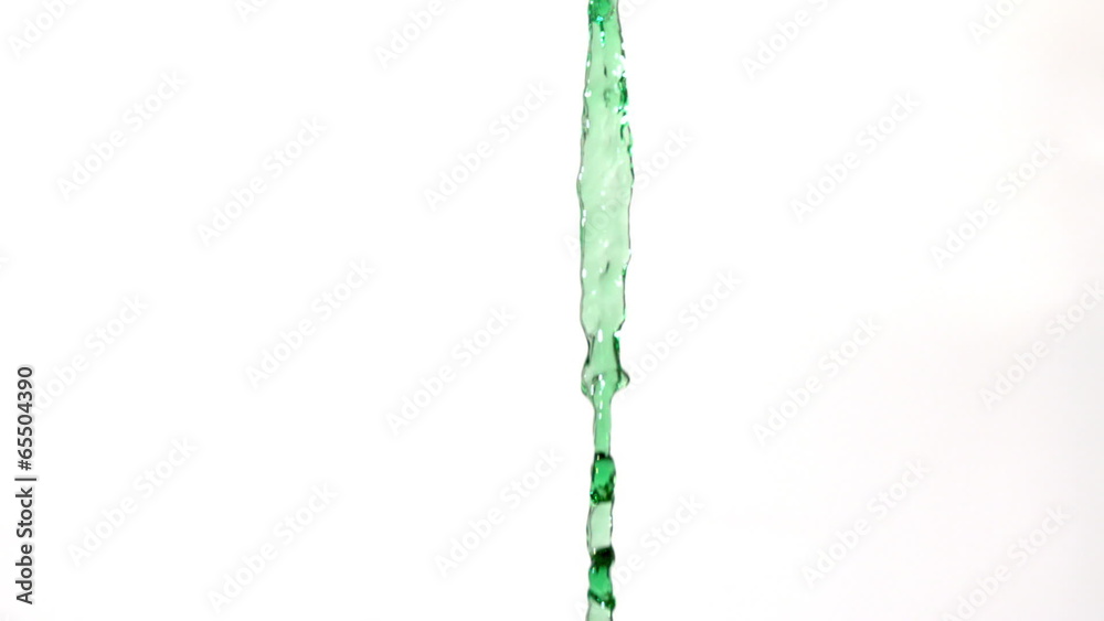 Green water pouring across white background