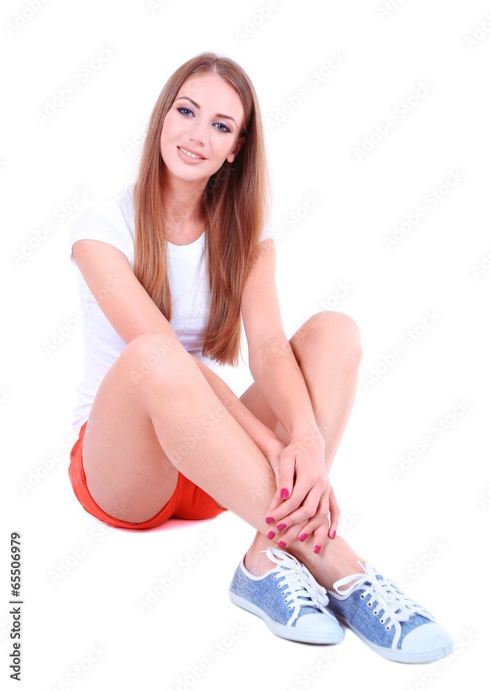 Beautiful young girl in shorts and t-shirt isolated on white Beautiful young girl in shorts and t-shirt isolated on white