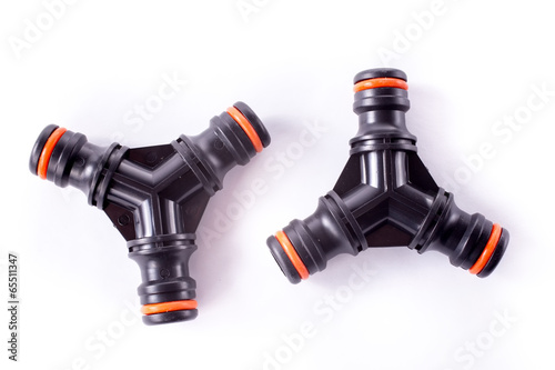 Adapter for connection of a garden hose with watering system