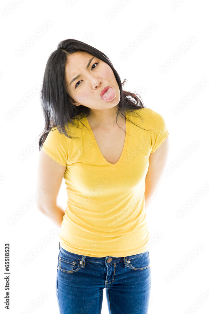 Young Asian woman sticking out her tongue Young Asian woman sticking out her tongue