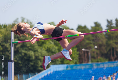 sportswoman jumps in height