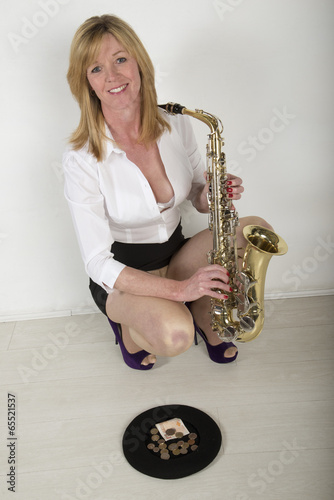 Woman busking with her saxophone photo