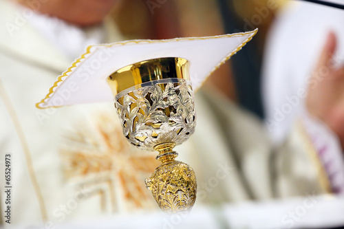 Chalice on the altar during the mass photo