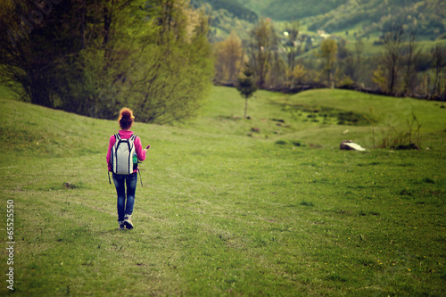 Woman hiker on meadow, with copyspace © Xalanx