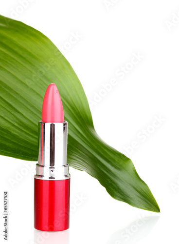 lipstick on green leaf isolated on white