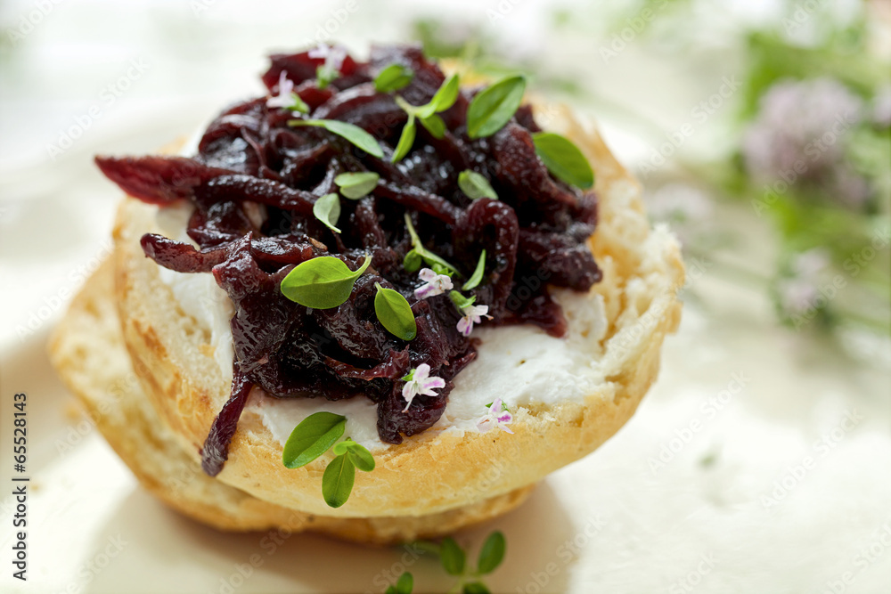 Canape with caramelized onion chutney and goat cheese Stock Photo
