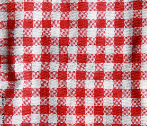 Texture of a red and white checkered picnic blanket.