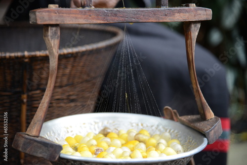 Silk extraction from cacoons in Thailand photo