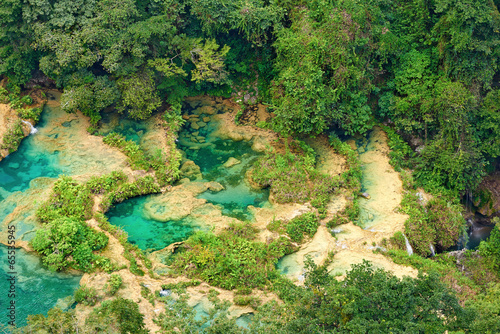 View from the top to the cascades in the jungles of Guatemala