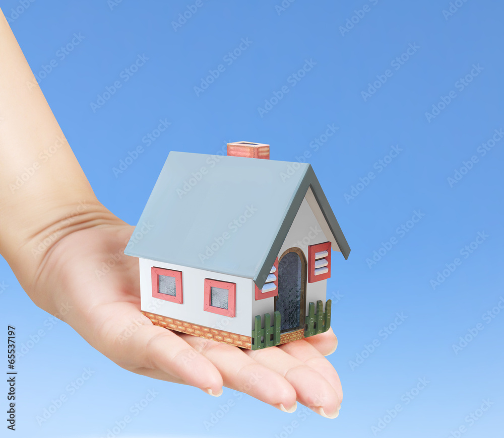 holding house representing home ownership holding house representing home ownership
