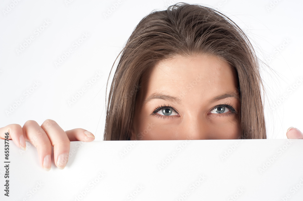 woman hiding behind billboard woman hiding behind billboard