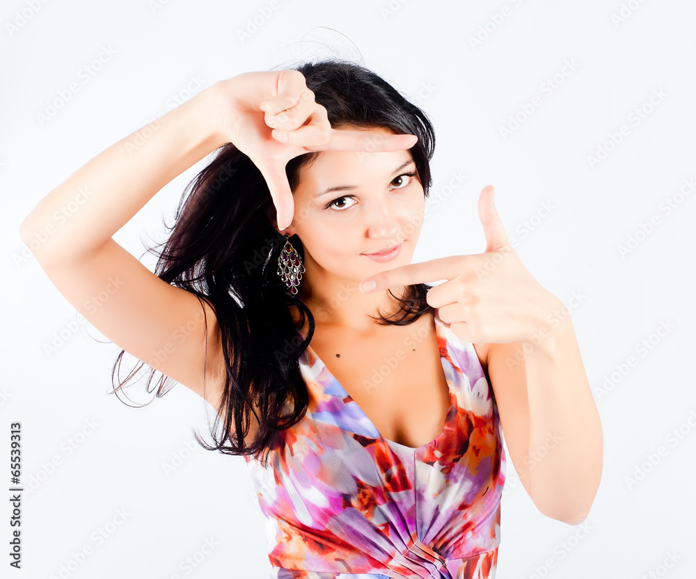 Fototapeta premium Girl with frame gesture. Focus on fingers