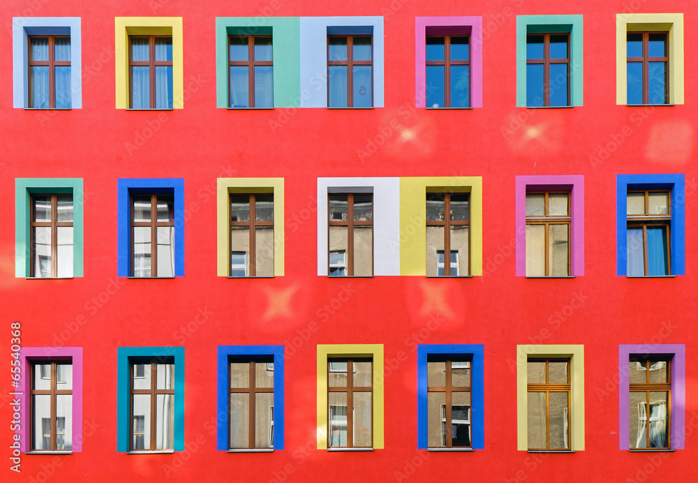 Red facade with colourful windows
