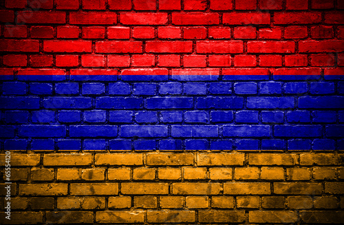 Brick wall with painted flag of Armenia