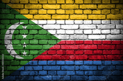 Brick wall with painted flag of Comoros